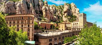 Fontanero Monistrol de Montserrat en calle histórica con vista al Monasterio, mezclando tradición y servicios locales
